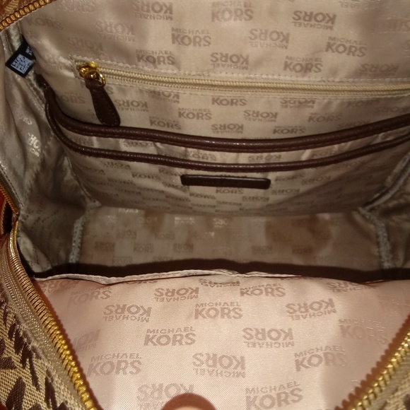 Micheal khors book bag and a swiss legend watch
